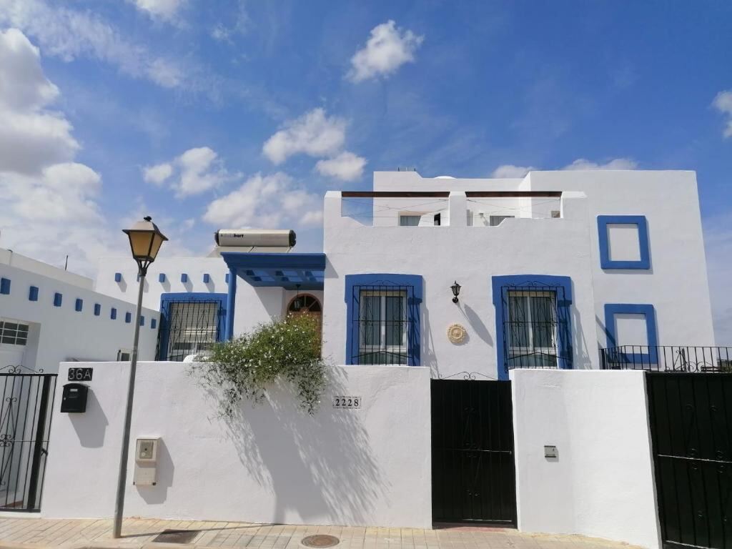 Front view of Casa Cabo de Gata under a blue sky